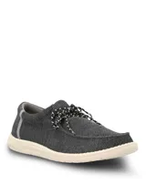 Alpargata Hush Puppies modelo Canyon, color negro con textura tejida. Presenta cordones jaspeados en blanco y negro, y suela de EVA en color crema.