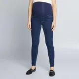 Jegging de jean azul oscuro para maternidad, con cintura alta de punto elástico azul marino. Corte ajustado.