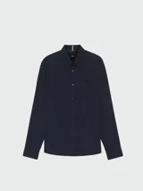 Camisa de lino de corte slim fit en color celeste, con cuello abotonado y mangas largas.