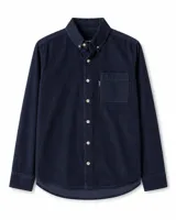 Camisa de manga larga confeccionada en pana gruesa de color azul marino. Presenta cuello con botones, cierre frontal con botones en contraste y un bolsillo en el pecho con etiqueta de marca.