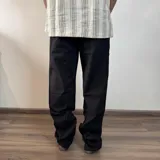 Pantalon de lino corte recto en color negro, con cintura elástica y cordón ajustable.