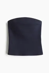 Top strapless de punto acanalado color azul marino, con borde superior curvo y forro parcial.