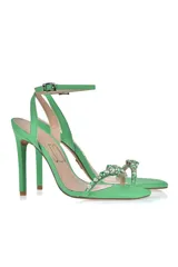 Sandalias de fiesta color amarillo flúor con taco aguja alto, tira delantera con apliques de strass y pulsera al tobillo con hebilla.