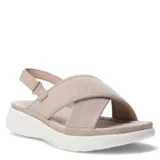 Sandalias de plataforma con tiras cruzadas en tejido técnico color beige y ajuste de velcro en el talón. Posee una suela blanca de diseño ergonómico.