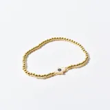 Pulsera dorada de cuentas pequeñas con dije de mano de Fátima con ojo turco.