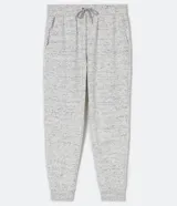 Pantalón tipo jogging de algodón con efecto jaspeado, cintura elástica con cordón de ajuste y puños acanalados en los tobillos. Cuenta con bolsillos laterales.