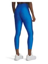 Calza deportiva Under Armour de tiro alto, confeccionada en tejido elástico con tecnología de secado rápido. Presenta un diseño bicolor en tonos azules, combinando una parte superior lisa con paneles inferiores estampados con textura sutil. Incluye bolsillo lateral y logo de la marca en el muslo derecho.