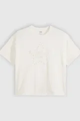 Remera Levi's de corte relajado, color blanco marfil, con diseño gráfico central de una estrella delineada con aplicaciones de strass y bordado de la marca en el interior.