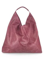 Maxi bolso gris con textura tejida, doble asa de hombro y forma trapezoidal.