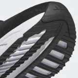 Championes de running Adidas Adistar 3, color negro con tres franjas laterales blancas. Presentan una entresuela gruesa blanca con diseño texturizado y suela negra.