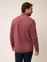 Buzo de abrigo azul melange con cierre frontal completo, cuello alto y bolsillos laterales, confeccionado en mezcla de algodón y poliéster.