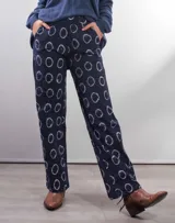 Pantalón de vestir azul marino con estampado de círculos blancos.