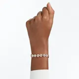 Pulsera rígida con eslabones de metal con baño de oro rosa y cristales transparentes decorados con pavé.