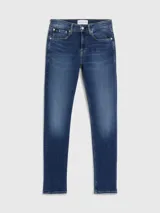 Jeans de corte skinny confeccionados en denim de algodón elástico con lavado azul oscuro vintage. Presentan diseño clásico de cinco bolsillos, talle bajo y cierre de cremallera.
