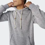 Canguro Rip Curl Crescent Hood de tejido melange gris, con capucha ajustable por cordones crudos con topes de PU, bolsillo tipo canguro frontal con ribetes y etiqueta tejida de la marca.