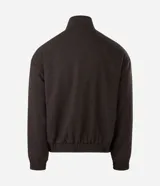 Campera bomber puffer de color marrón oscuro, confeccionada en poliéster con acabado texturizado. Presenta cuello alto, cierre frontal con cremallera, puños y ruedo elásticos.