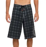Short de baño tipo boardshort Billabong de color negro con patrón de cuadros grises y blancos, con cordón ajustable en la cintura y el logo de la marca bordado en la pierna izquierda.