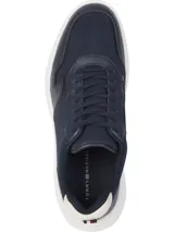 Zapatillas deportivas Tommy Hilfiger color azul marino, con exterior de malla y cuero sintético, suela gruesa blanca y detalles en blanco en el talón.