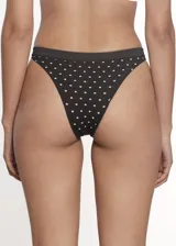 Pack de seis bombachas tipo cola less confeccionadas en microfibra sin costuras. Presentan un diseño estampado con pequeños puntos y estrellas brillantes, con el logo de la marca en la cintura. Incluye refuerzo de algodón en la zona íntima.