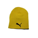 Gorro de lana negro con escudo del Club Atlético Peñarol bordado en amarillo. Es reversible y del otro lado tiene rayas horizontales amarillas y negras.