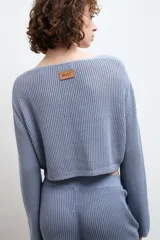 Cardigan celeste de tejido de punto con escote en V y lazo de ajuste frontal.