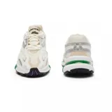 Championes Lacoste L003 2K24, color blanco con detalles en plateado y verde.