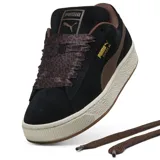 Championes Puma modelo Suede XL Wild, color negro y chocolate, confeccionados en gamuza con cordones anchos de estampado animal print, suela gruesa y detalles dorados.