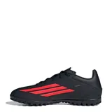 Championes de fútbol Adidas modelo F50 Club, color negro con detalles en rojo vibrante. Presentan un diseño aerodinámico con cordones y textura en la superficie para un mejor control del balón.
