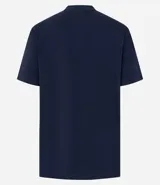 Remera marrón de algodón con cuello redondo y mangas cortas. Presenta un aplique de corazón con volados en el frente.