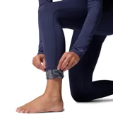 Calza térmica deportiva Columbia Midweight Stretch Omni-Heat en color azul marino, de diseño ajustado y elástico, con tecnología Omni-Wick para control de humedad y costuras planas.