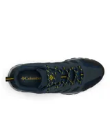Championes de senderismo Columbia modelo Crestwood Low, color azul marino con detalles en negro y amarillo. Confeccionados en una combinación de gamuza y tejido, cuentan con mediasuela ligera para mayor amortiguación y suela de caucho con tracción para un agarre superior.