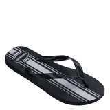 Sandalias tipo ojota Havaianas color negro con diseño de franjas verticales en gris y blanco. Presentan tiras negras con textura grabada y logo de la marca.