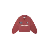 Buzo tipo polo color marsala con cuello, mangas largas amplias y cierre frontal parcial. Cuenta con parches bordados en el pecho y el texto "EMESTUDIOS" estampado en blanco.