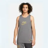 Musculosa Nike reversible de color gris con estampado gráfico dorado en el pecho y etiqueta decorativa en el borde inferior.