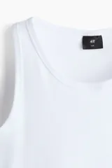Musculosa de H&M en punto acanalado de mezcla de algodón, con corte ajustado y bajo recto.
