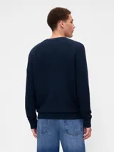 Buzo de punto de algodón con cuello redondo, mangas tipo raglán y puños y ruedo acanalados.