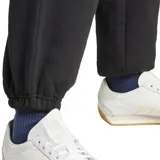 Pantalón de jogging negro de felpa con cintura elástica y logo de Adidas bordado en blanco.