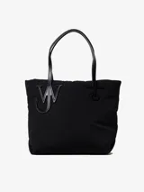 Bolso tote negro de nailon acolchado con asas de cuero y logo de ancla.