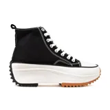 Zapatilla deportiva de caña alta, color negro y blanco, con suela gruesa de goma color caramelo.