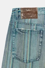 Jeans de tiro medio con diseño baggy y cinco bolsillos, confeccionados en denim con estampado de rayas verticales degradadas.
