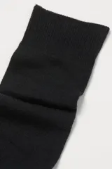 Pack de dos pares de medias de punto fino suave, diseñadas para llegar hasta la rodilla.
