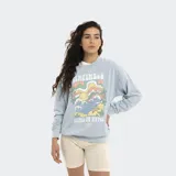 Buzo de algodón con cuello redondo y diseño holgado, con efecto lavado y estampa frontal colorida con motivos de playa y olas.