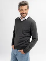 Buzo de punto con escote en V, manga larga y puños acanalados, confeccionado en tejido liso.