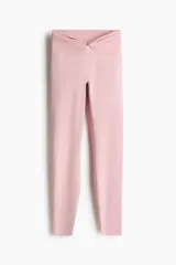 Leggings deportivos de tiro alto en tejido funcional color rosado con detalle girado en la cintura.