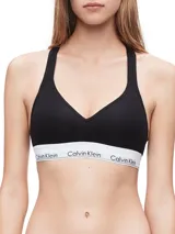 Bralette deportivo negro de algodón modal, con copas sin costuras con relleno, tiras cruzadas en la espalda y banda inferior elástica blanca con logo de Calvin Klein.