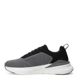 Championes deportivos Umbro modelo Lyro, con capellada de tejido técnico en combinación de colores negro y gris. Presenta el logo de la marca en el lateral, cierre con cordones y suela de goma blanca con refuerzo negro en la puntera.