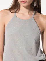 Top negro de punto con strass, escote halter con cuello a la base y breteles finitos cruzados en la espalda.