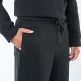 Pantalón de jogging negro de muletón con cordones ajustables en la cintura.