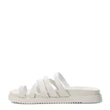 Sandalias planas color marfil, con múltiples tiras finas en el empeine y un separador para el dedo. Cuenta con suela estilo plataforma baja y diseño deslizable.