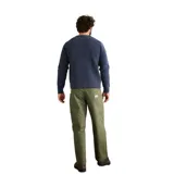 Buzo de punto con cuello redondo y diseño jaspeado en tonos azules con motas multicolores. Presenta una textura acanalada y corte clásico.